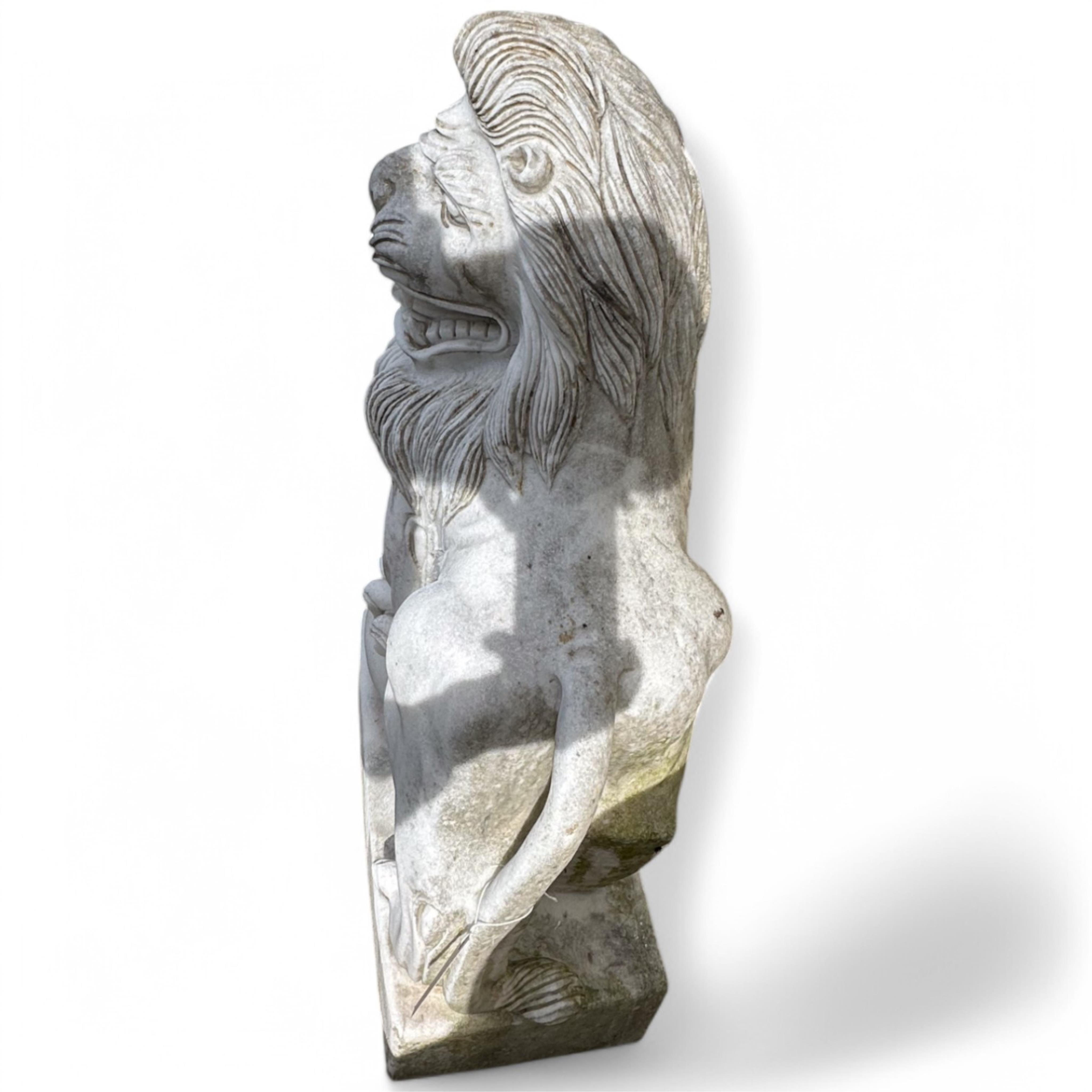 A pair of reconstituted white marble models of lions rampant